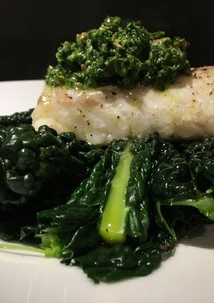 A picture of Roasted cod with cavolo nero and salsa verde.
