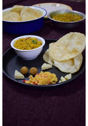 A picture of Luchi cholar dal(Bengal gram dal and puri).