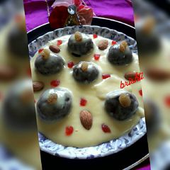A picture of Beetroot Gulabjamun in Custard.