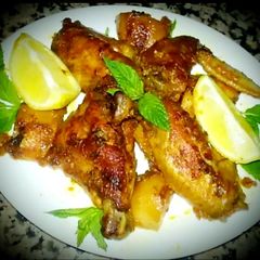A picture of Oven Grilled Chicken Wings With Potato In Awesome Sauce😜👍🎄.