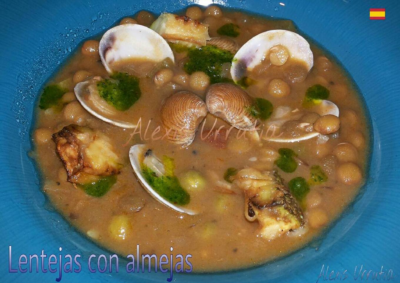 Lentejas con almejas, y gotas de aceite de perejil y tomillo