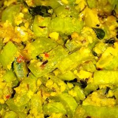 Snake Gourd Coconut Stir Fry (புடலங்காய் தோரன்) A picture of Snake Gourd Coconut Stir Fry (புடலங்காய் தோரன்).
