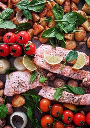 A picture of One pan baked salmon and veggies.