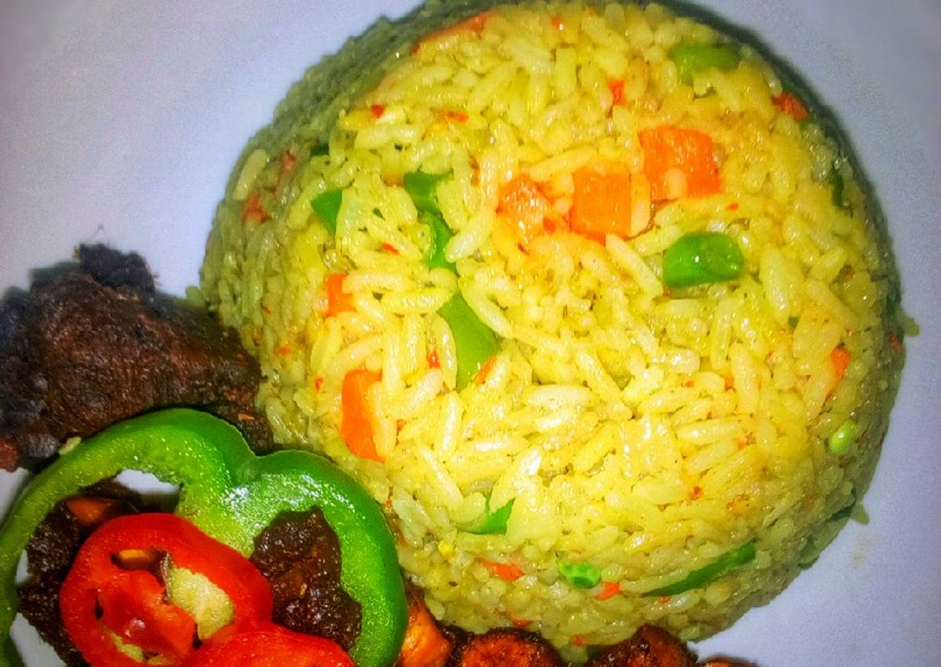 Fried rice, with peppered goat meat and dodo