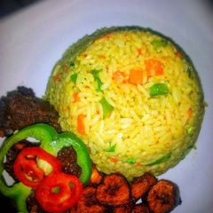 Fried rice, with peppered goat meat and dodo A picture of Fried rice, with peppered goat meat and dodo.