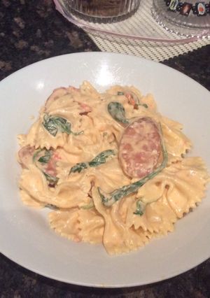 A picture of Chorizo with pink sauce.