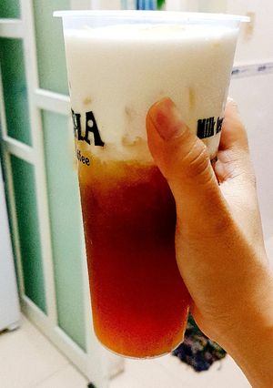 Hình của món Trà đào machiato.