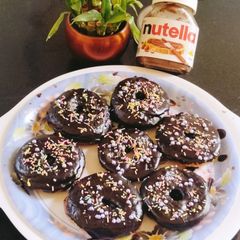 A picture of Chocolate Donuts 😋 🍩🍩🍩🍩.
