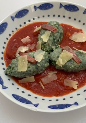 A picture of Gnudi with Tomato Sauce and Speck.