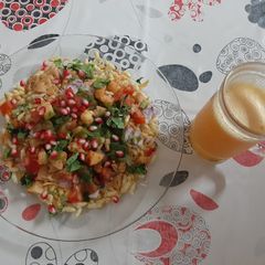 A picture of Bhel & Orange Juice.