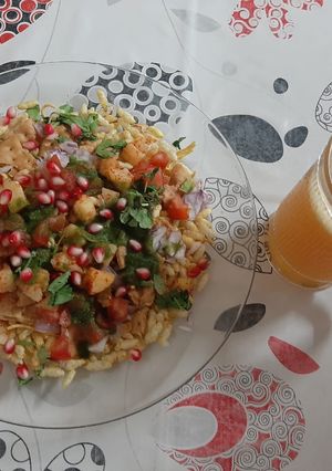 A picture of Bhel & Orange Juice.