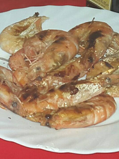Una foto de Langostinos al whisky