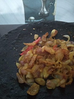 A picture of Tawa Fry Onions.
