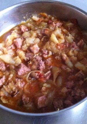 Une photo de Porc au pâtisson oignons et tomates
