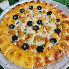 A picture of Cheesy Bites Tikka Pizza 🍕🍕.