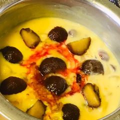A picture of Gulab jamun custard dessert.