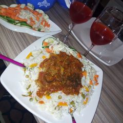 A picture of Veggies rice and stew.