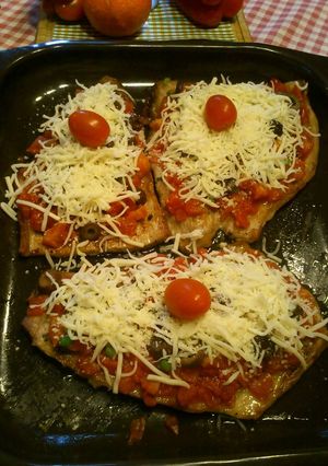 Una foto de Matambrito de cerdo a la pizza