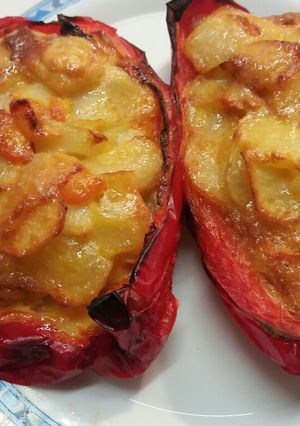 A picture of Red Peppers Stuffed with Tortilla, Onion, and Carrot.