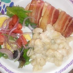 A picture of Cream Cheese Stuffed & Bacon Wrapped Breast.