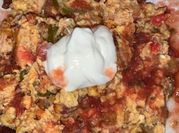 A picture of scrambled egg with chicken
