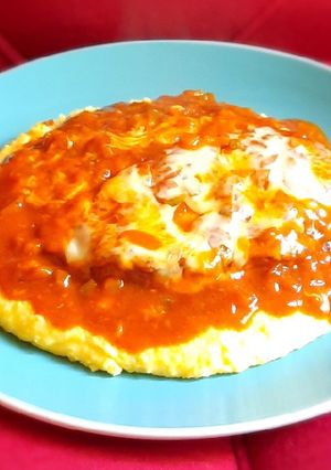 Una foto de Pollo a la parmesana y polenta