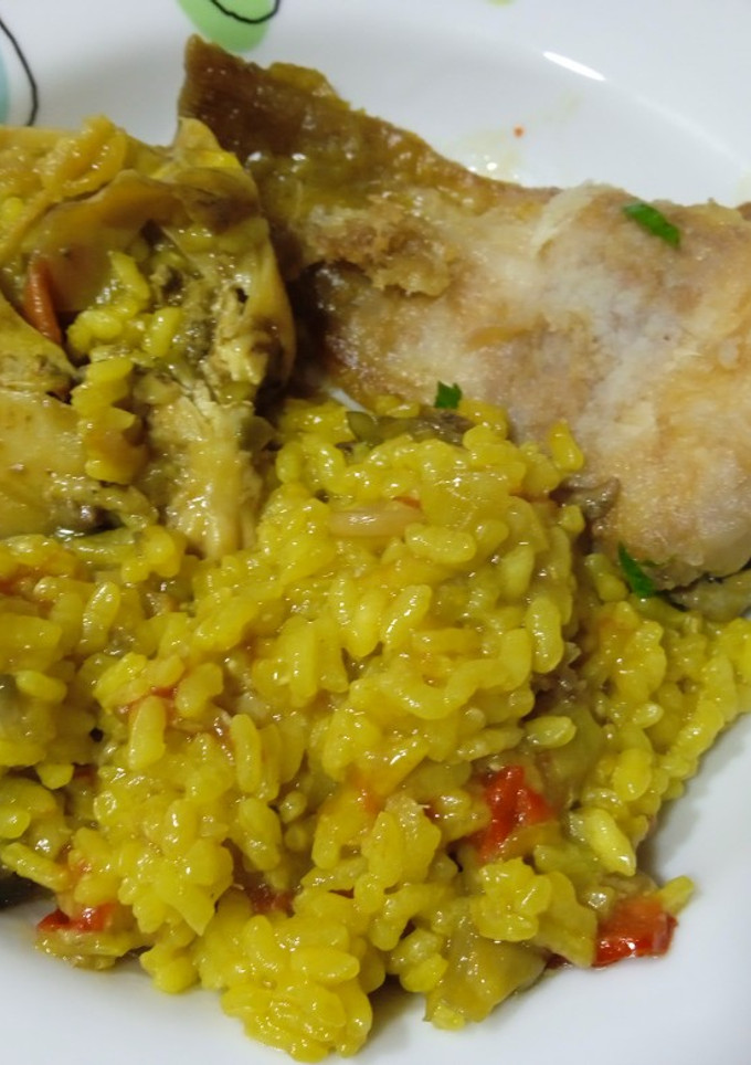 Una foto de Arroz meloso con raya y sepia