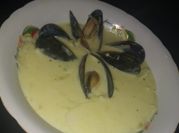 Una foto de mejillones con mantequilla