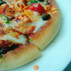 Restaurant style paneer Tikka pizza A picture of Restaurant style paneer Tikka pizza.