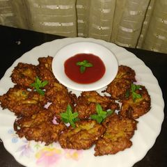 A picture of Kadu ke pakory(pumpkin fritters).