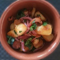 A picture of Sautèed Seasonal Mushrooms and Potatoes with Speck and Parsley.