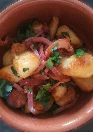 A picture of Sautèed Seasonal Mushrooms and Potatoes with Speck and Parsley.