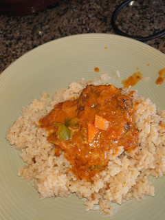 A picture of Fish curry saved with fried onion rice.