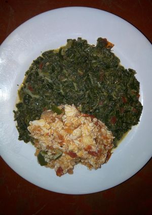 A picture of Fried Eggs with traditional vegetables.