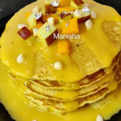 A picture of Fruits Pancakes with Mango Chocolate Ganache.