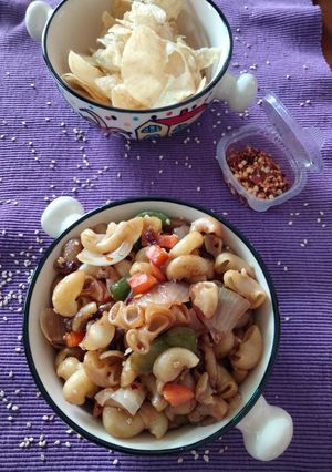 A picture of Macaroni in butter and roasted sesame dressing.