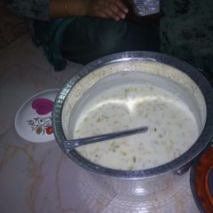 A picture of Kheer with dry fruits and rice.