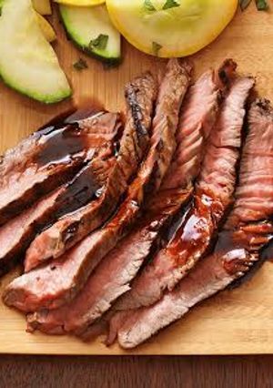A picture of Sirloin Steak with Deep Red Wine Reduction.