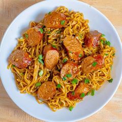 A picture of Indomie noodles and sausage.