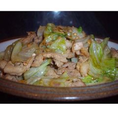 A picture of Iceberg lettuce and pork stir fry.