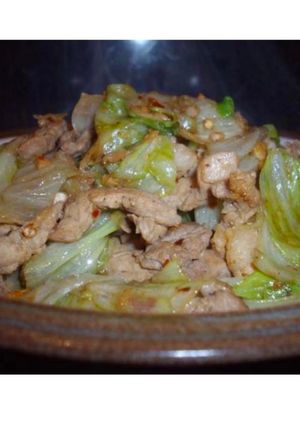 A picture of Iceberg lettuce and pork stir fry.