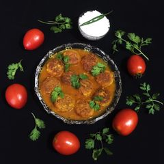A picture of Chena / Paneer Kofta Curry.