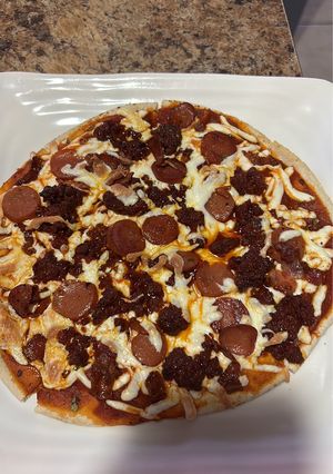 A picture of Cold Cuts Pizza on Pita Bread.