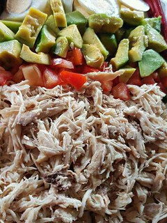A picture of Simple Chicken and Avocade salad with honey lime dressing.