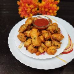 A picture of Rice flour, Urad dal and vegetables pakore.
