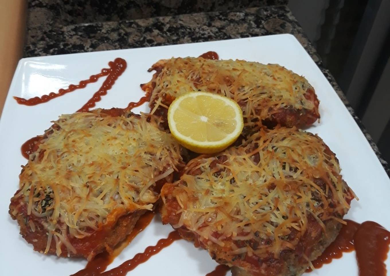 Pechugas empanadas y gratinadas en el horno
