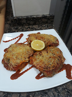 Una foto de Pechugas empanadas y gratinadas en el horno