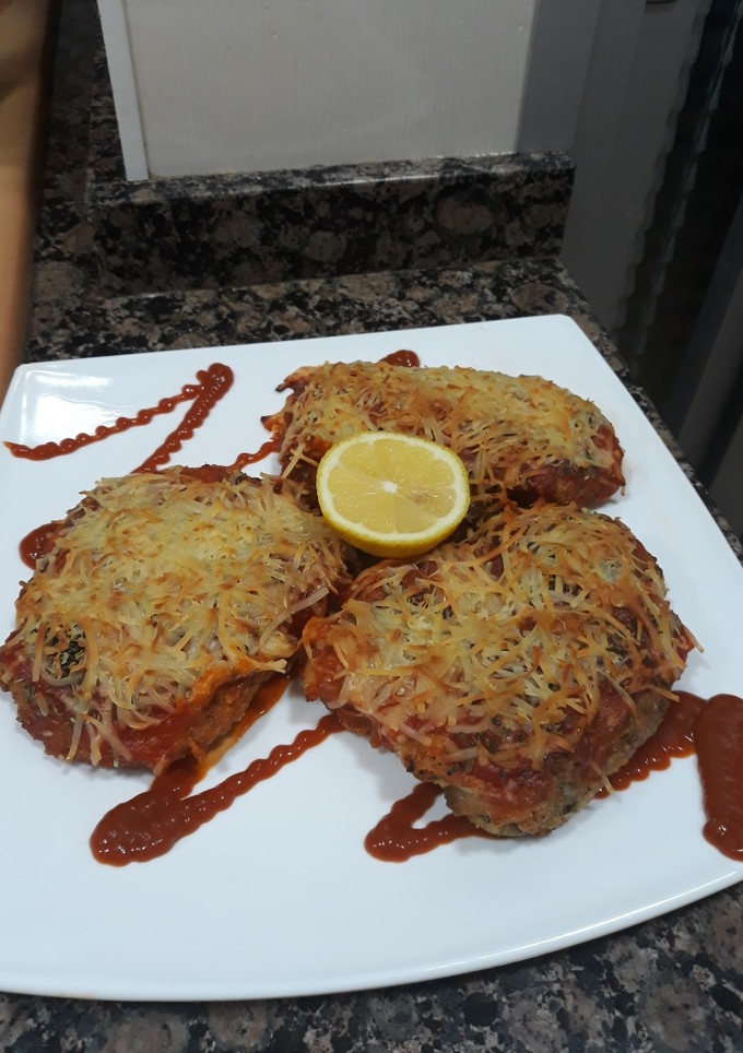 Una foto de Pechugas empanadas y gratinadas en el horno