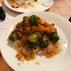 A picture of Charred salmon and sprouts.
