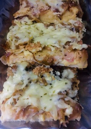 Una foto de FAINÁ RELLENA DE JAMÓN Y QUESO 🍕🍖🧅🧀🍕 (en licuadora) 🍕🍖🧀🍕🧅🍕